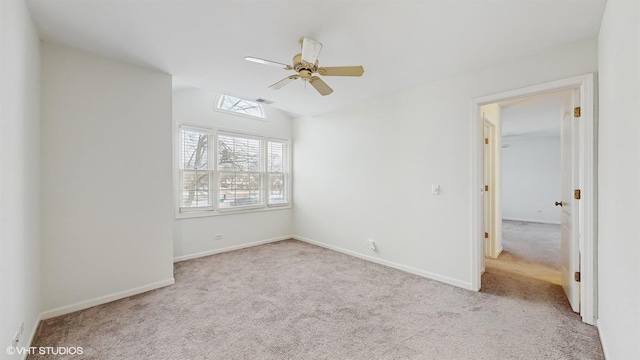 spare room with light carpet and ceiling fan