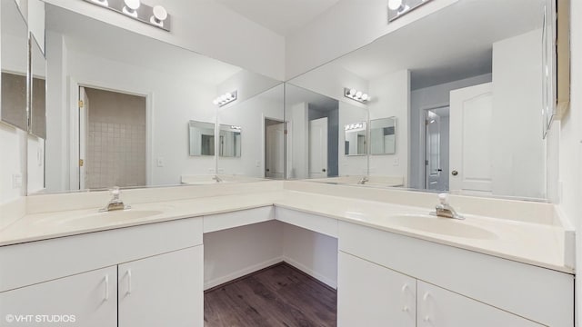 bathroom with hardwood / wood-style floors and vanity