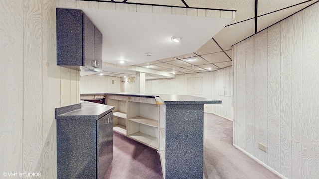 bar featuring a paneled ceiling and wood walls