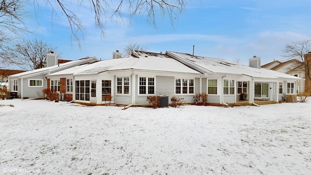 view of snow covered house