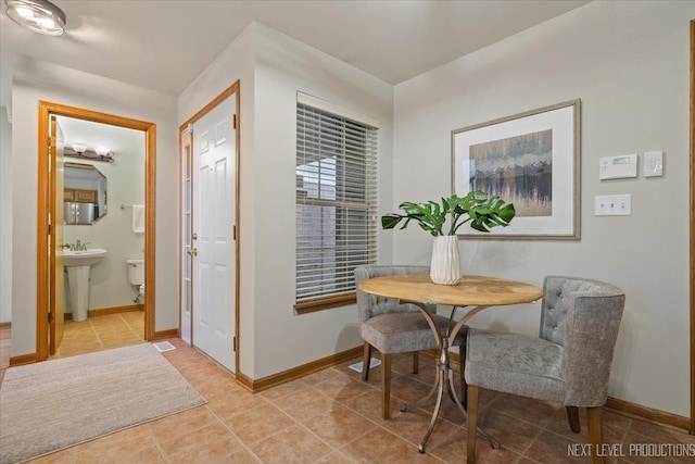 tiled dining area with sink