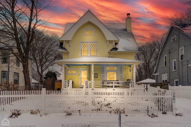 victorian-style house featuring covered porch