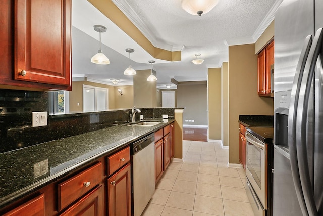 kitchen featuring sink, light tile patterned floors, dark stone counters, and appliances with stainless steel finishes