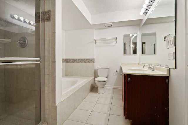 full bathroom featuring vanity, tile patterned floors, toilet, a textured ceiling, and independent shower and bath