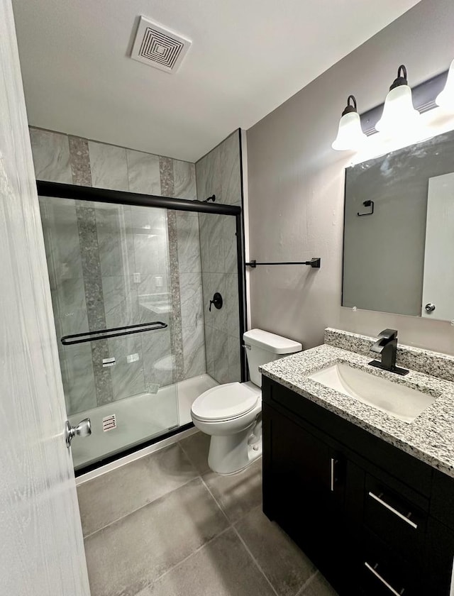 bathroom with vanity, toilet, and walk in shower