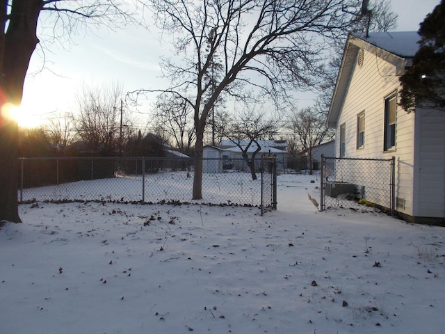 view of yard layered in snow