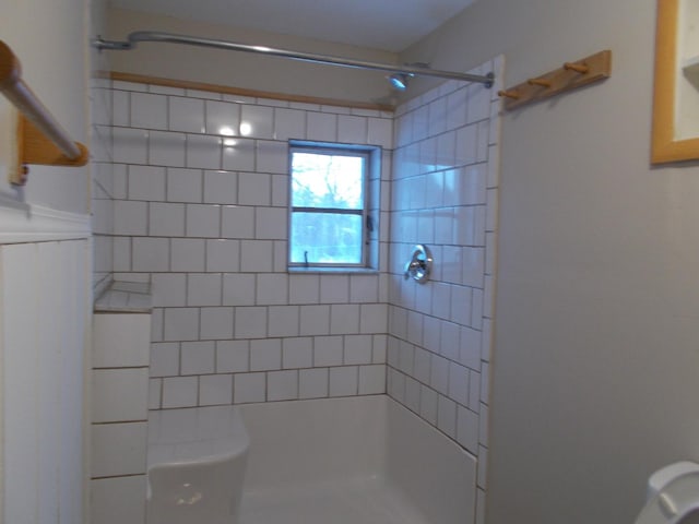 bathroom with a tile shower