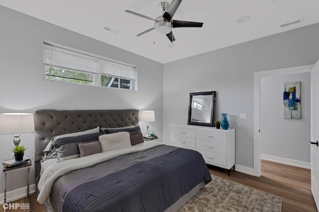 bedroom with ceiling fan and dark wood-type flooring