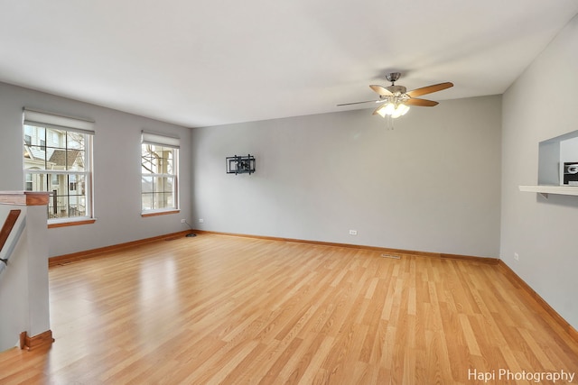 unfurnished living room with ceiling fan and light hardwood / wood-style flooring