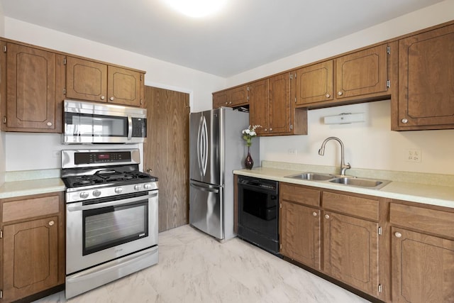 kitchen featuring stainless steel appliances and sink