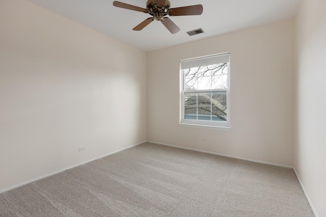 empty room featuring carpet and ceiling fan