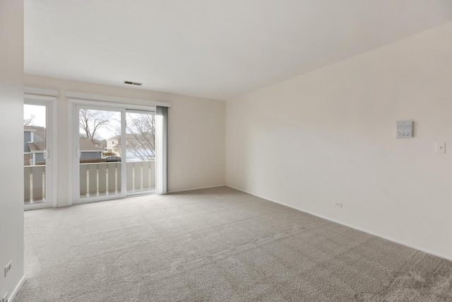 empty room featuring light carpet