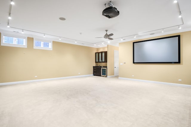 home theater featuring carpet and ceiling fan