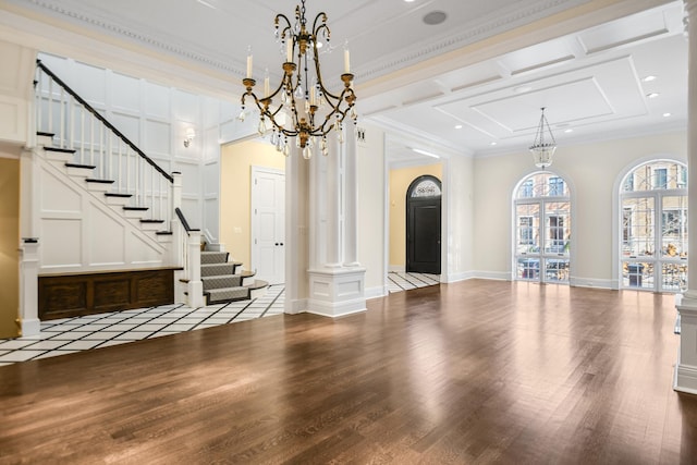 interior space featuring wood-type flooring, decorative columns, crown molding, and coffered ceiling