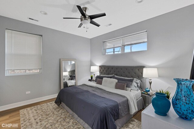 bedroom featuring ceiling fan and light hardwood / wood-style flooring