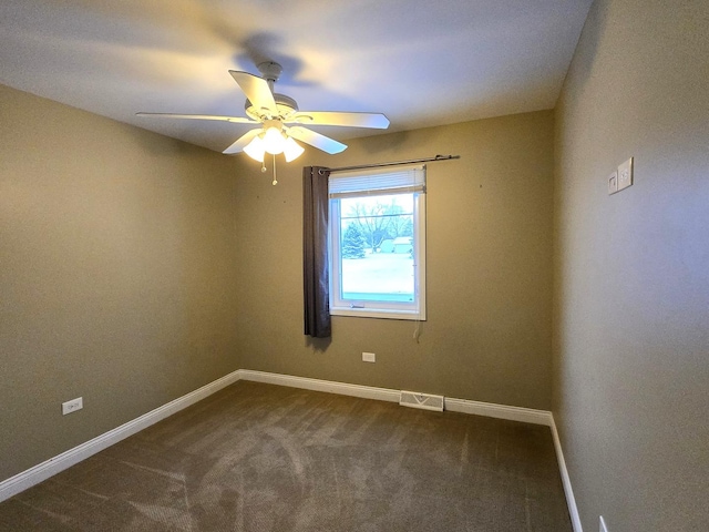 empty room featuring carpet flooring and ceiling fan