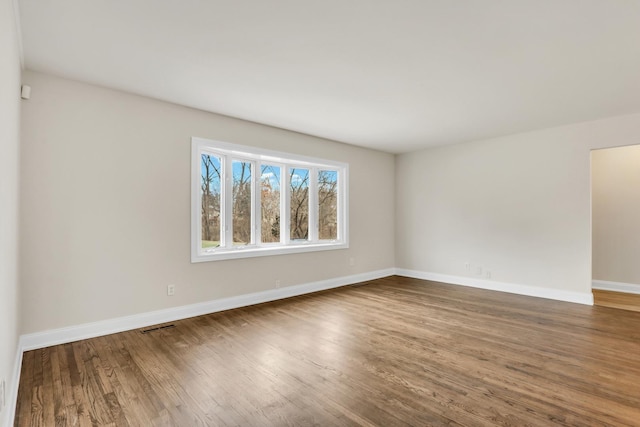 spare room featuring hardwood / wood-style floors