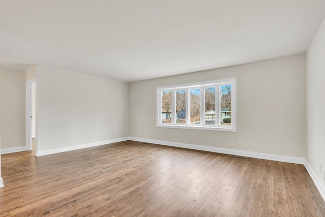 unfurnished room with light hardwood / wood-style flooring