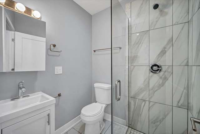 bathroom featuring toilet, vanity, baseboards, marble finish floor, and a shower stall