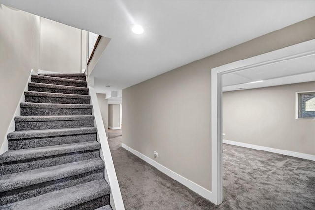 stairway featuring baseboards, carpet flooring, and recessed lighting