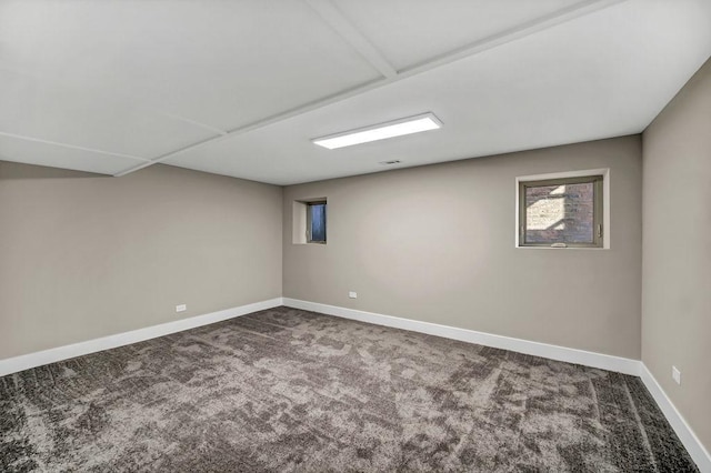 below grade area featuring carpet floors and baseboards