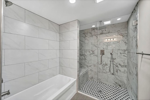 full bath with a shower stall, a bath, and recessed lighting