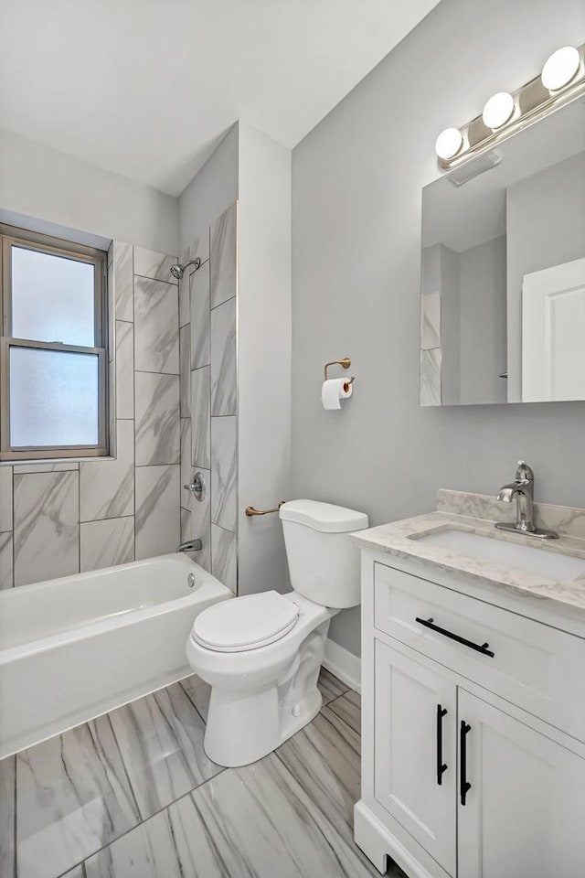 bathroom with toilet,  shower combination, and vanity