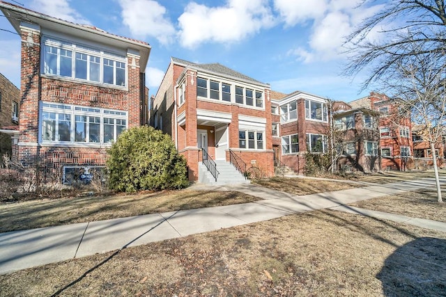 view of front of home featuring brick siding