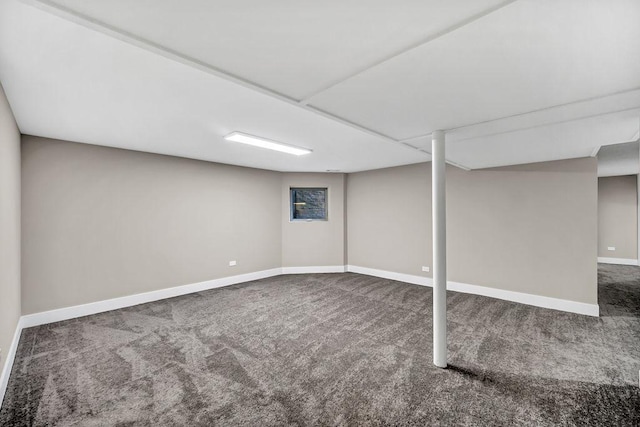 finished basement featuring carpet and baseboards