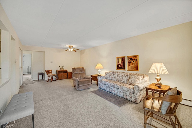 carpeted living room with ceiling fan