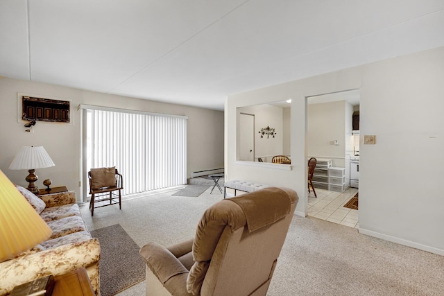 living room featuring light carpet and a baseboard heating unit