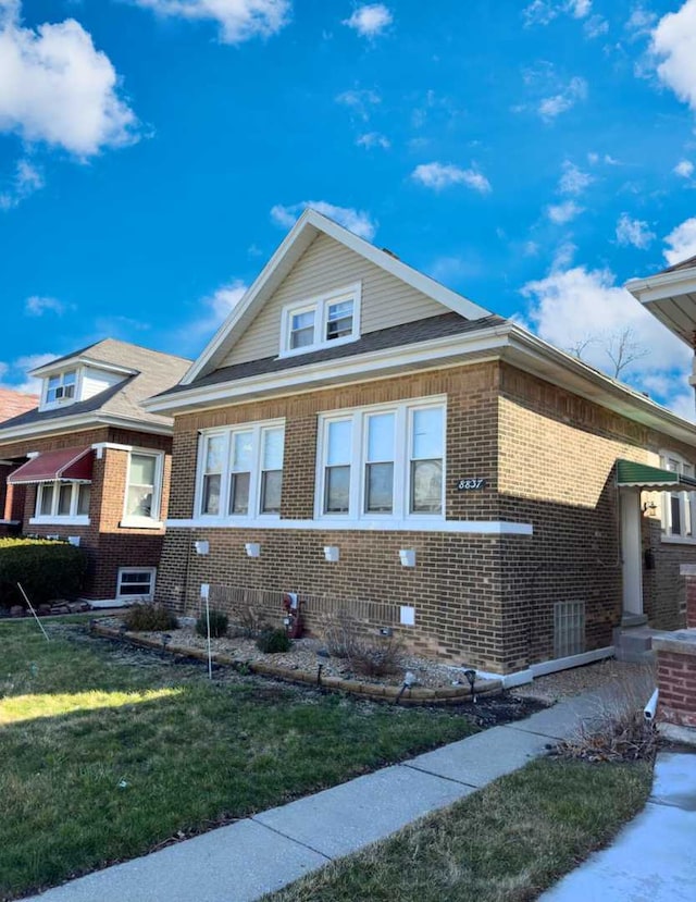 view of home's exterior featuring a yard