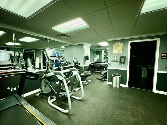 workout area with a paneled ceiling