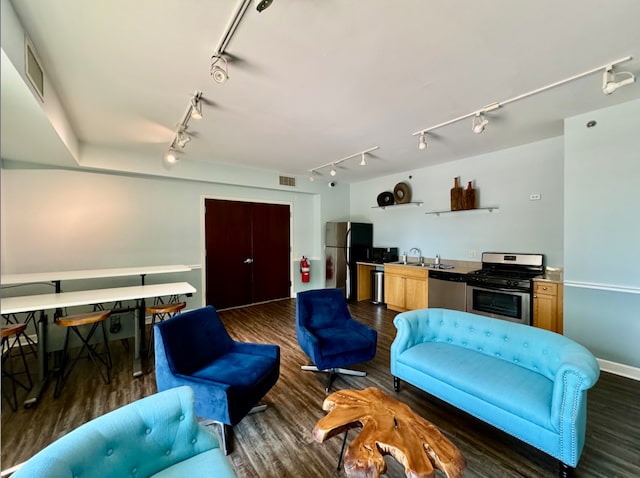 living room with sink and dark wood-type flooring