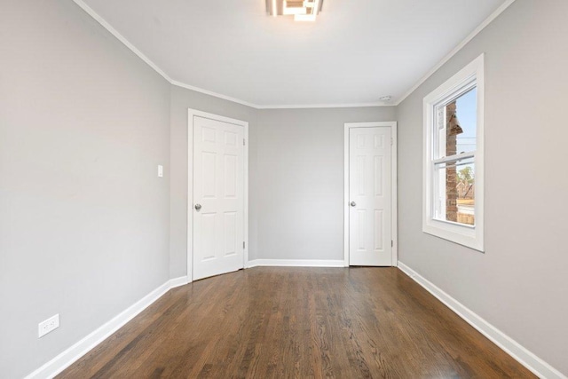 unfurnished room featuring crown molding and dark hardwood / wood-style floors