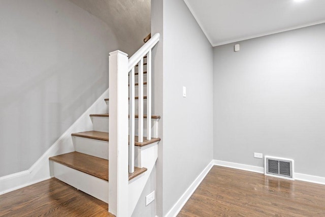 stairway with hardwood / wood-style flooring