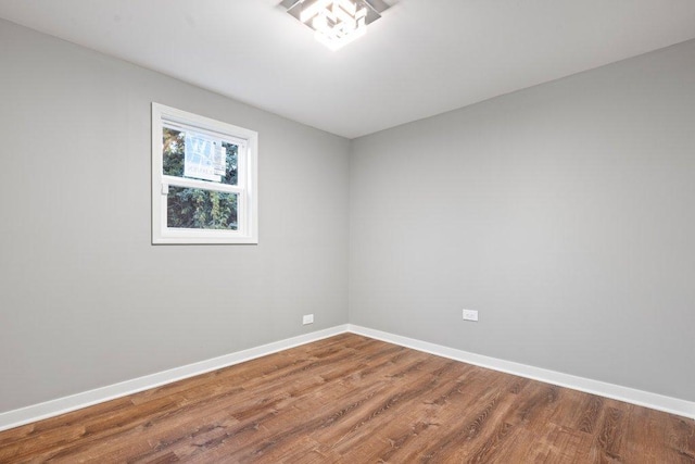 spare room featuring hardwood / wood-style flooring