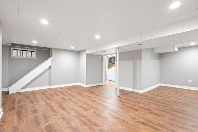 basement featuring hardwood / wood-style flooring