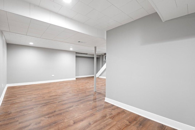 basement with wood-type flooring