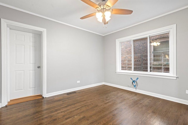 spare room with dark hardwood / wood-style floors, ceiling fan, and crown molding