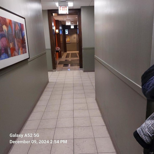 hallway featuring light tile patterned floors