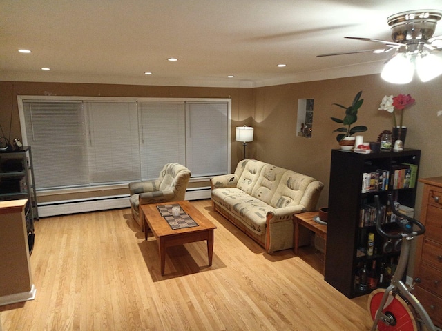 living room featuring ceiling fan, light hardwood / wood-style floors, and a baseboard radiator