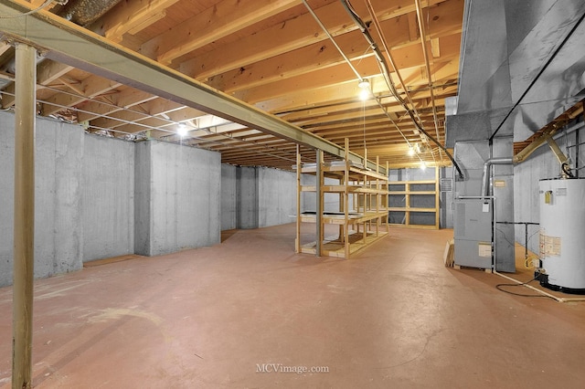 basement with water heater and heating unit