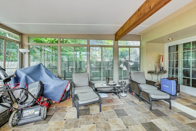 sunroom featuring beamed ceiling