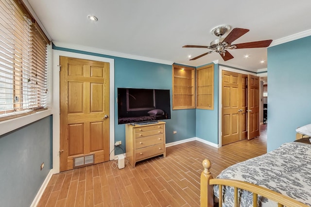 bedroom with wood-type flooring, a closet, ceiling fan, and crown molding