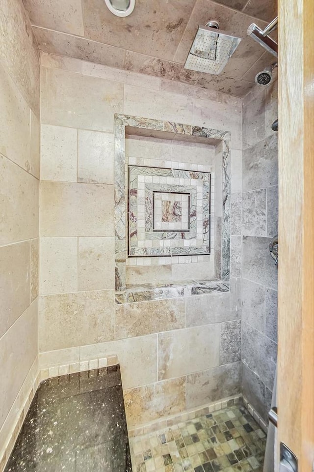 bathroom with tiled shower