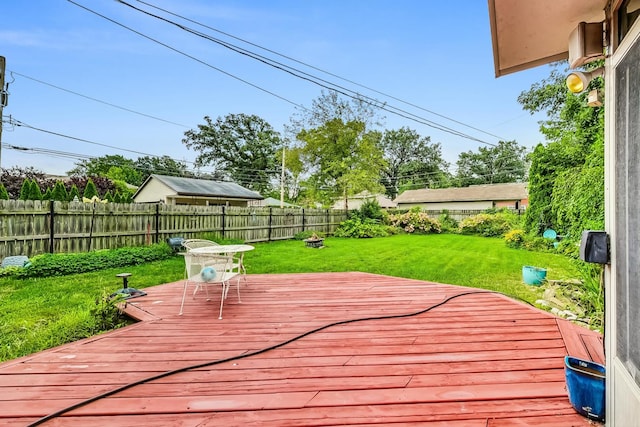 wooden deck with a yard