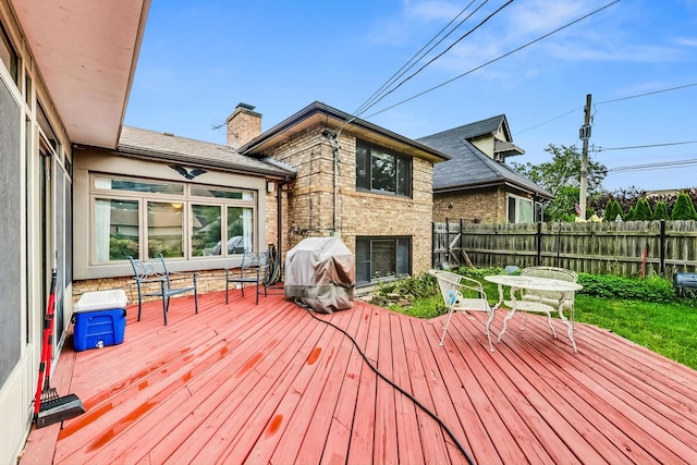 wooden deck with grilling area