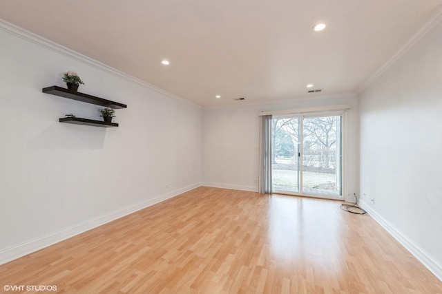 unfurnished room with ornamental molding and light hardwood / wood-style flooring