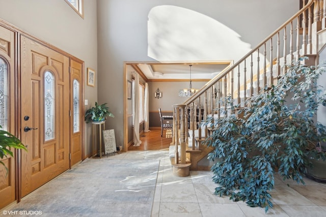 entryway with a chandelier